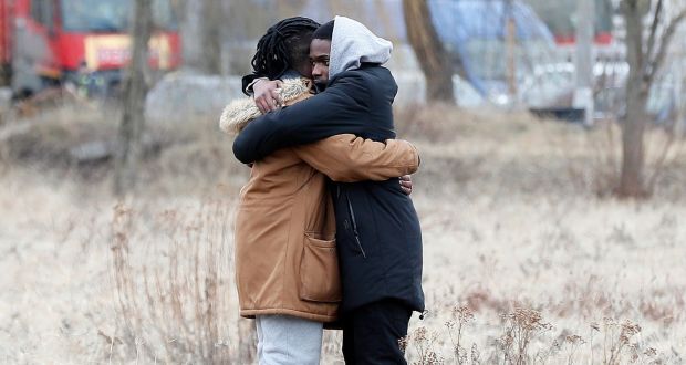 African students hugging it out in a field